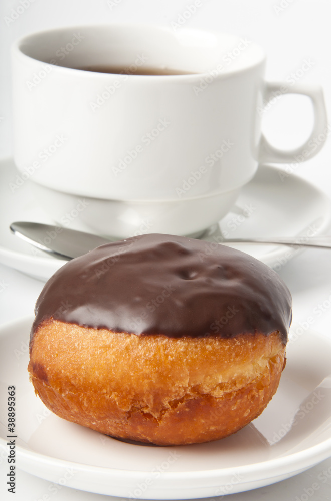 donut with chocolate and a cup of tea on a white background