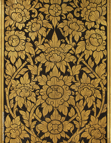 Gold damask pattern on thai temple's wall