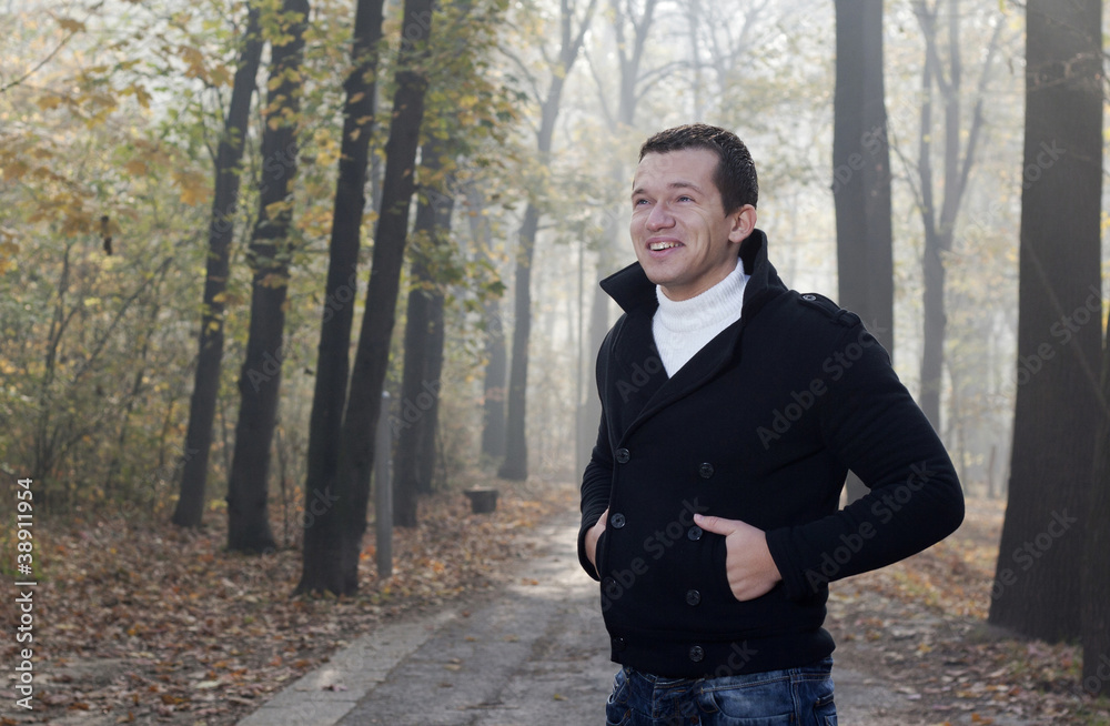 Young men posing in autumn park Young men posing in autumn park