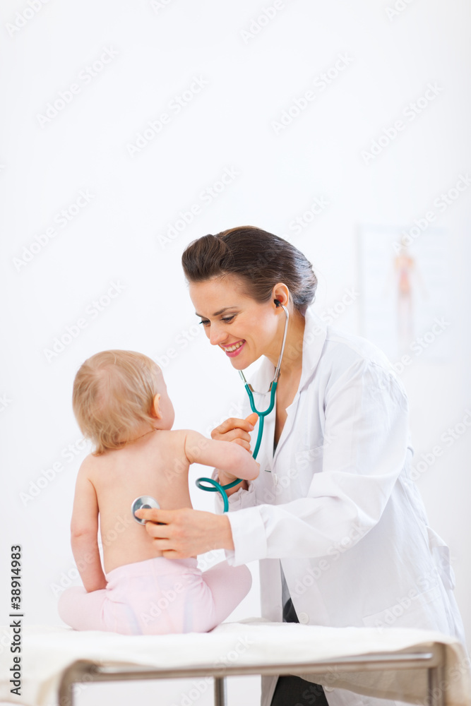 Pediatrician doctor examine kid using stethoscope Pediatrician doctor examine kid using stethoscope
