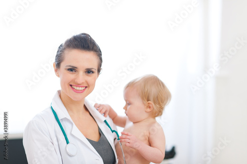 Portrait of pediatrician doctor with kid