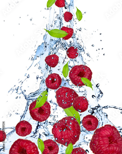 Raspberries in water splash, isolated on white background