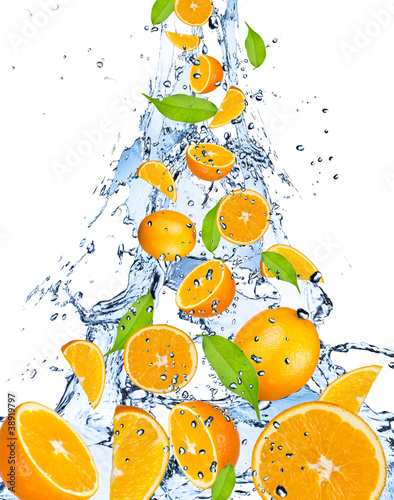 Fototapeta Naklejka Na Ścianę i Meble -  Oranges falling in water splash, isolated on white background