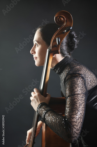 Classical musician cellist woman playing cello