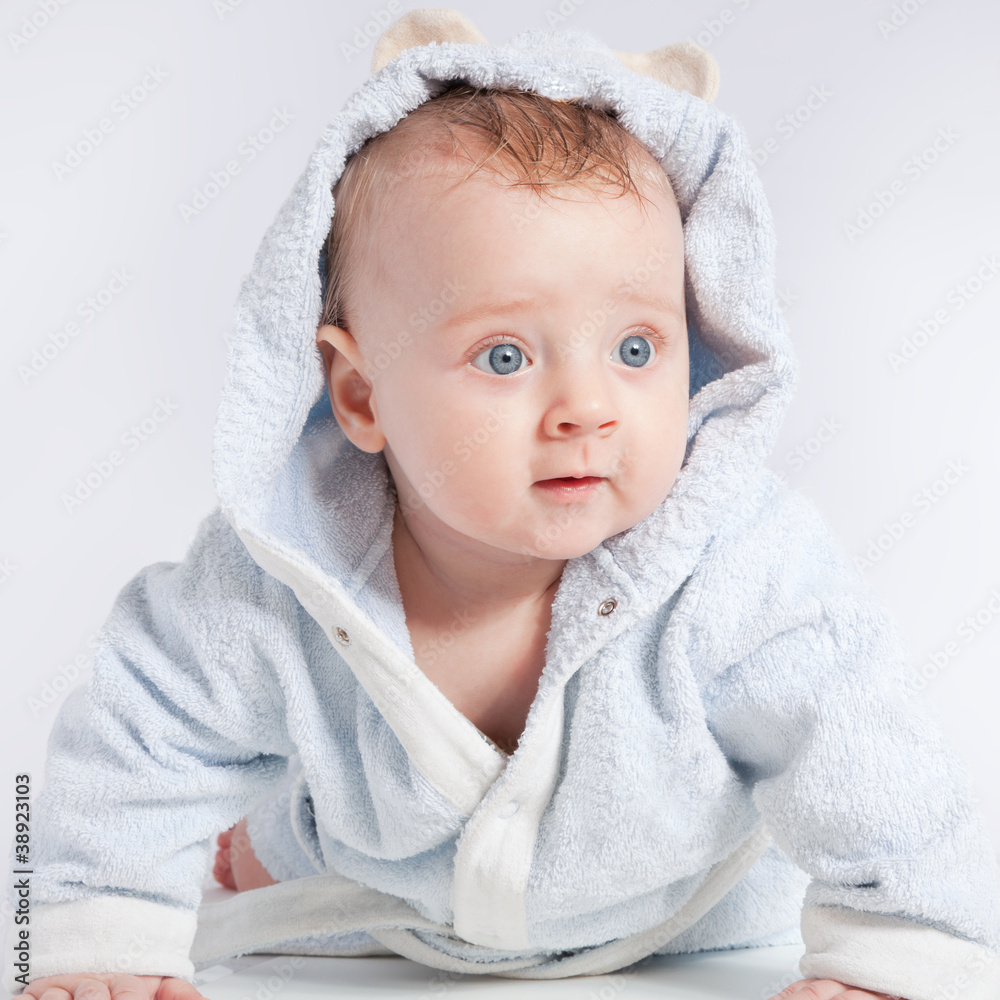 portrait of a cheerful child in blue bathrobe portrait of a cheerful child in blue bathrobe
