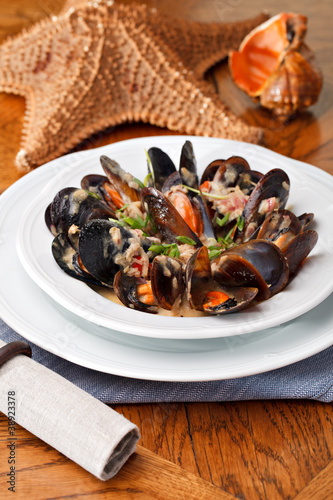 bowl with cooked mussels