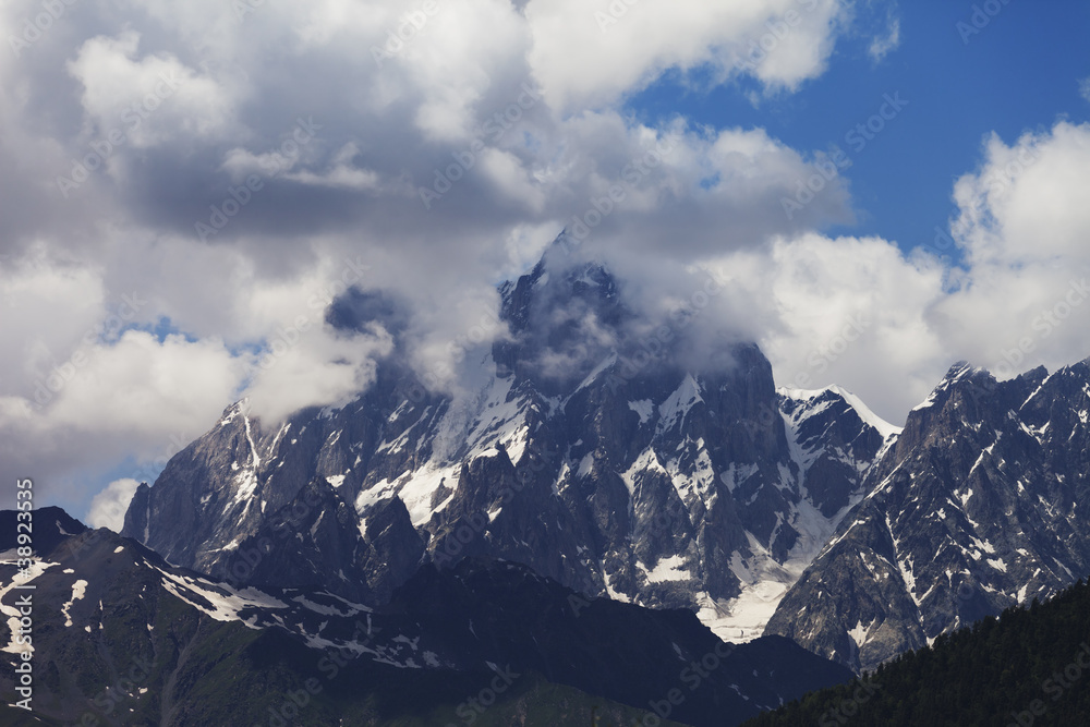 Mt. Ushba in clouds, Caucasus Mountains, Georgia.