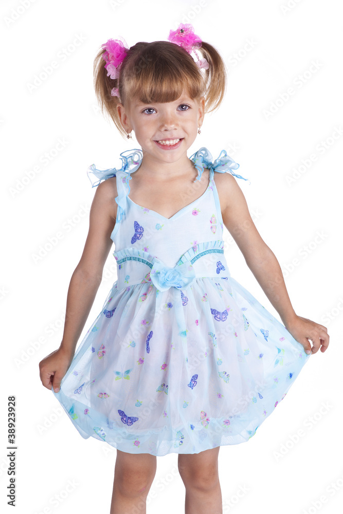Portrait of a cute little girl in blue dress