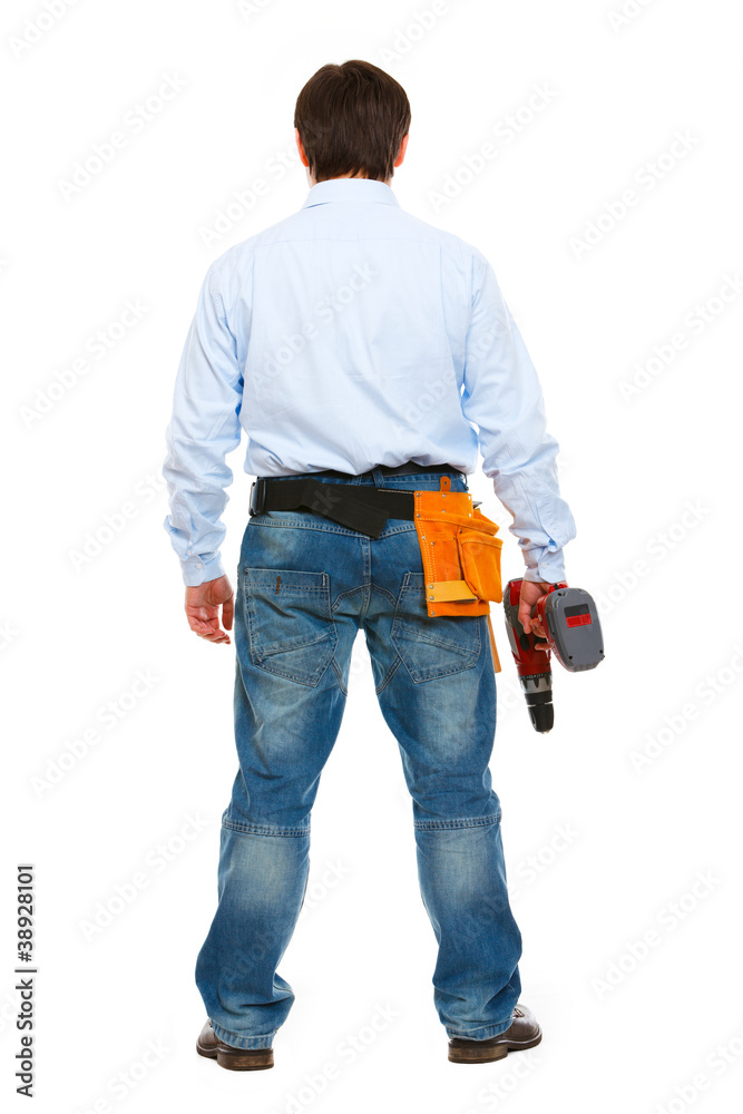 Portrait of construction worker standing back to camera Portrait of construction worker standing back to camera