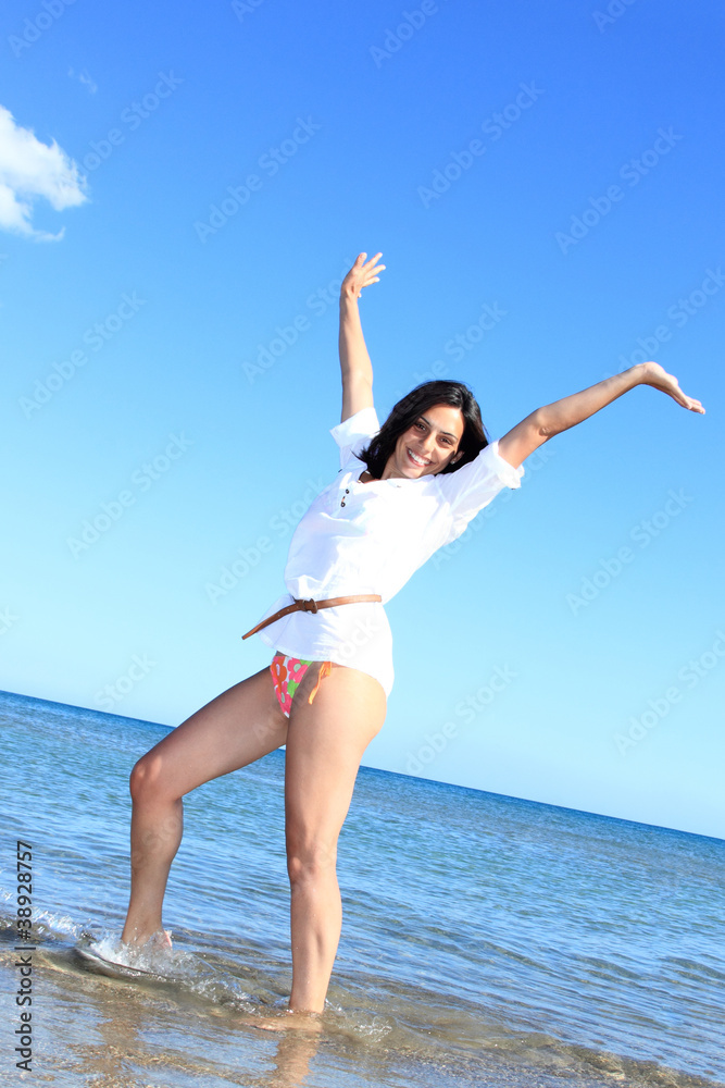 Photograph of a beautiful woman on the beach Photograph of a beautiful woman on the beach