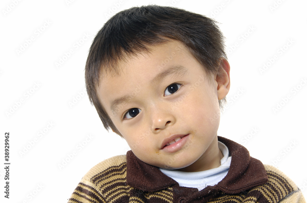 Photo of adorable young boy looking at camera Photo of adorable young boy looking at camera