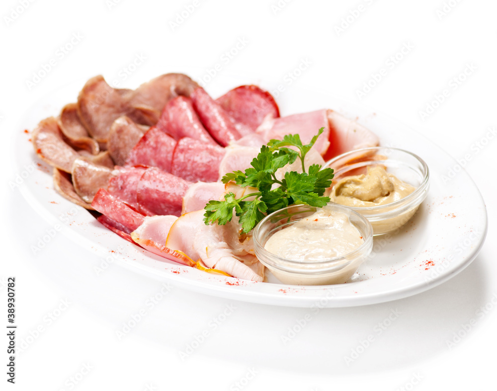 Meat delicatessen plate with souce