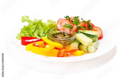 Fresh summer salad on white plate