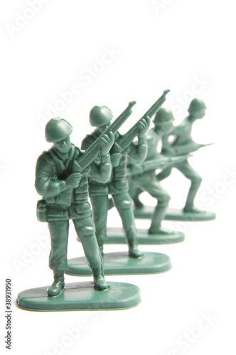 Four toy soldiers on a white background
