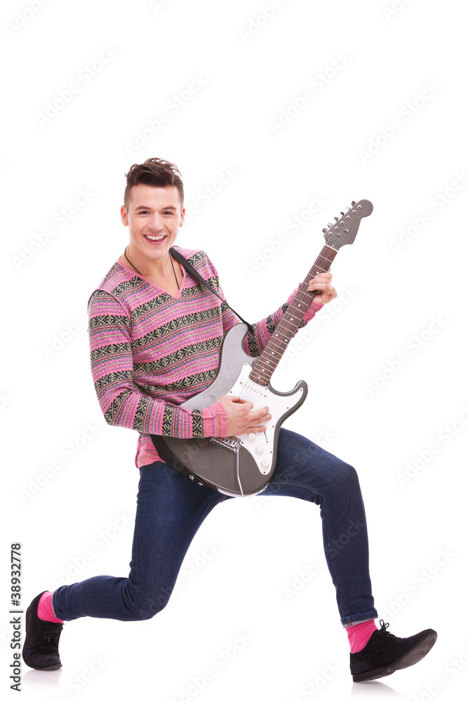 Guitarist Playing six-string electric guitar Guitarist Playing six-string electric guitar