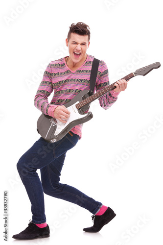 passionate guitarist playing an electric guitar
