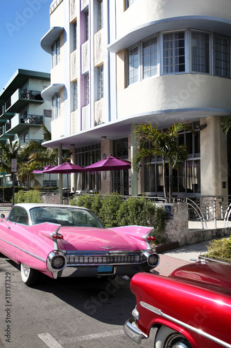 Old american car parked on Art Deco District, Miami Beach