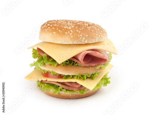 sandwich with ham,cheese and vegetables on white background