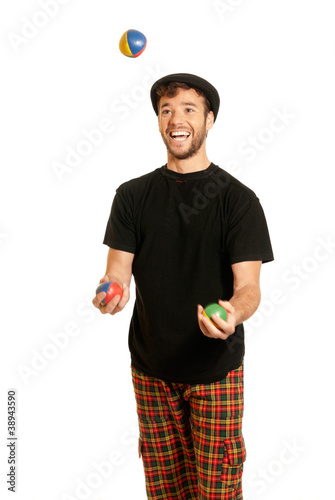 Young man juggling isolated on white background