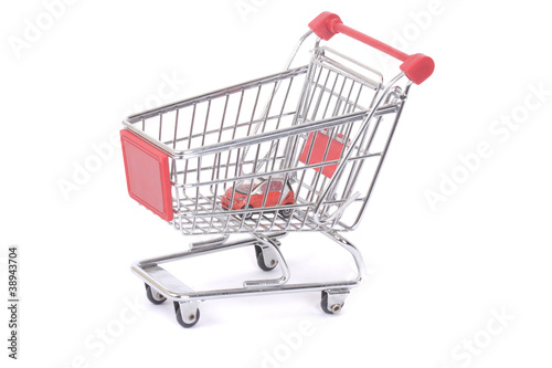 Metal shopping trolley isolated on white