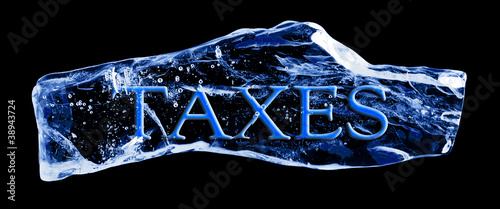 Word TAXES frozen in the ice on a black background