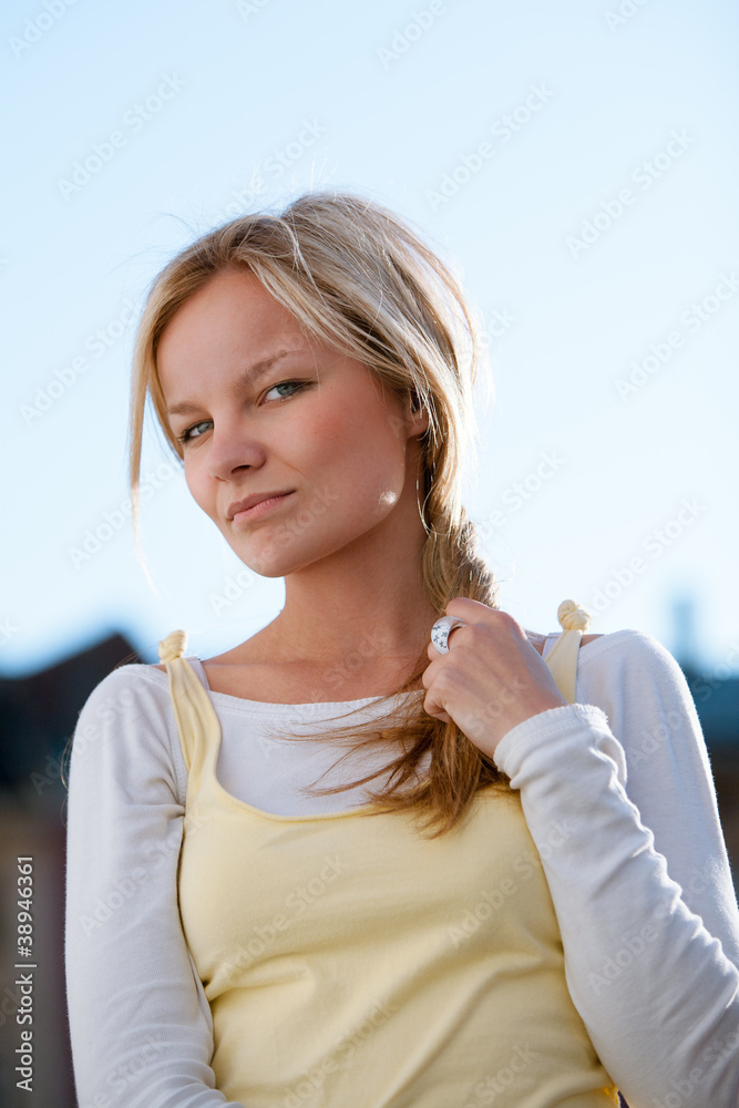Closeup portrait of a beautiful young woman outdoor.