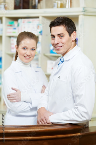 Two Pharmacy chemist workers in drugstore