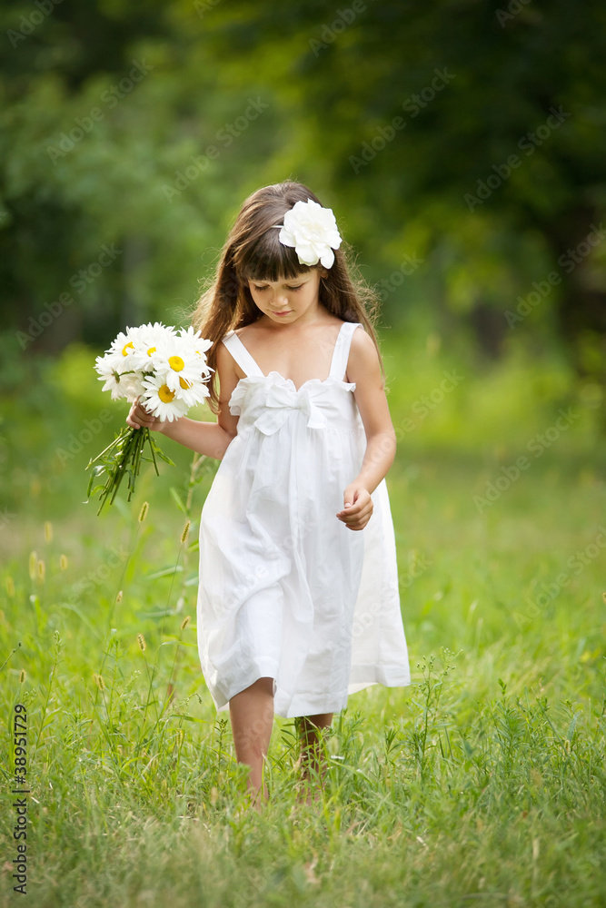 Portrait lovely girl in white with camomiles Portrait lovely girl in white with camomiles