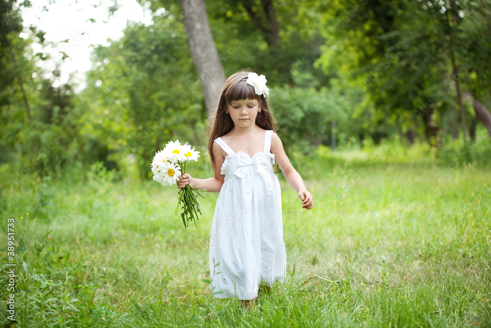 Portrait lovely girl in white with camomiles Portrait lovely girl in white with camomiles