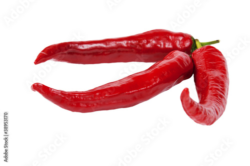 Three Red hot chilli peppers isolated on white