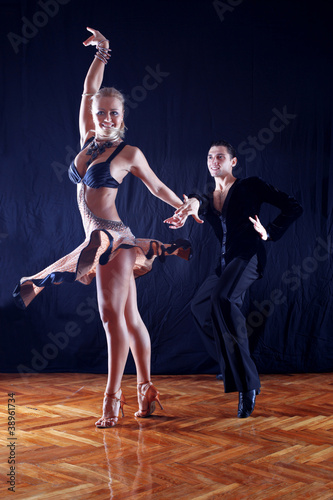 dancers against black background