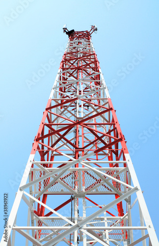 Mobile phone mast antenna on blue sky background