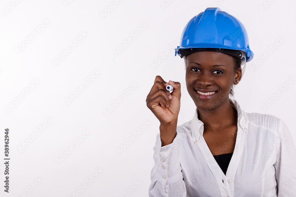 Copyspace image of woman with hard-hat making a drawing.. Copyspace image of woman with hard-hat making a drawing..