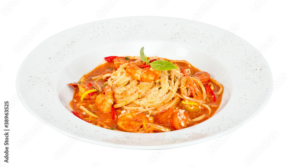 A plate of linguini with sauteed shrimp, tomato, chili and oliv A plate of linguini with sauteed shrimp, tomato, chili and oliv