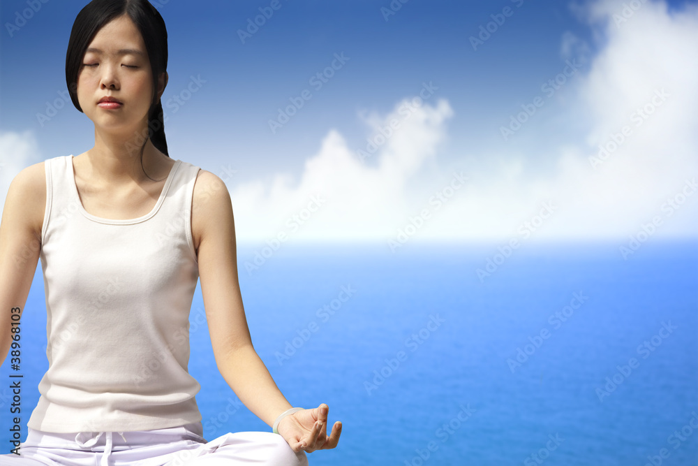 yoga woman with blue ocean background