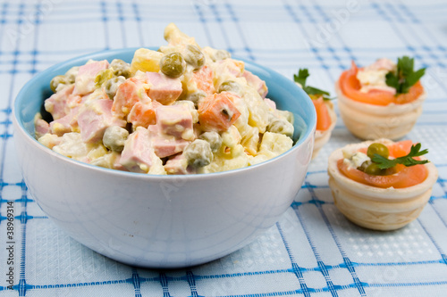 Russian traditional salad olivier with pea