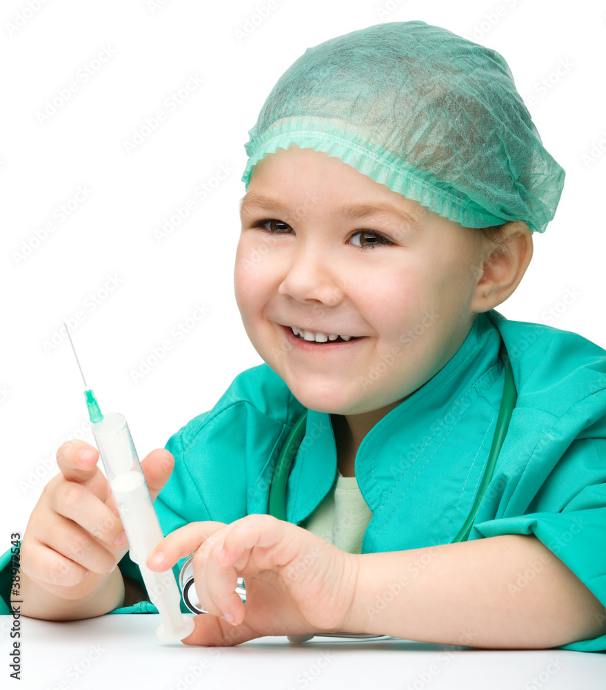 Cute little girl is playing doctor with syringe Cute little girl is playing doctor with syringe