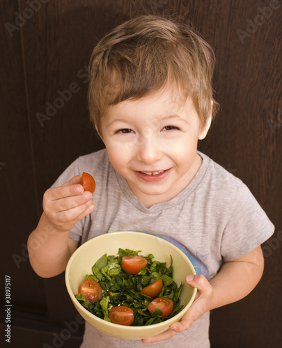 little boy with salad