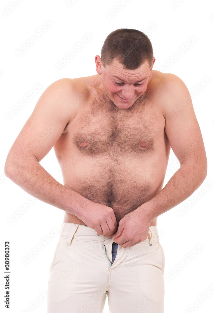 Naklejka premium A young man can not fasten little trousers