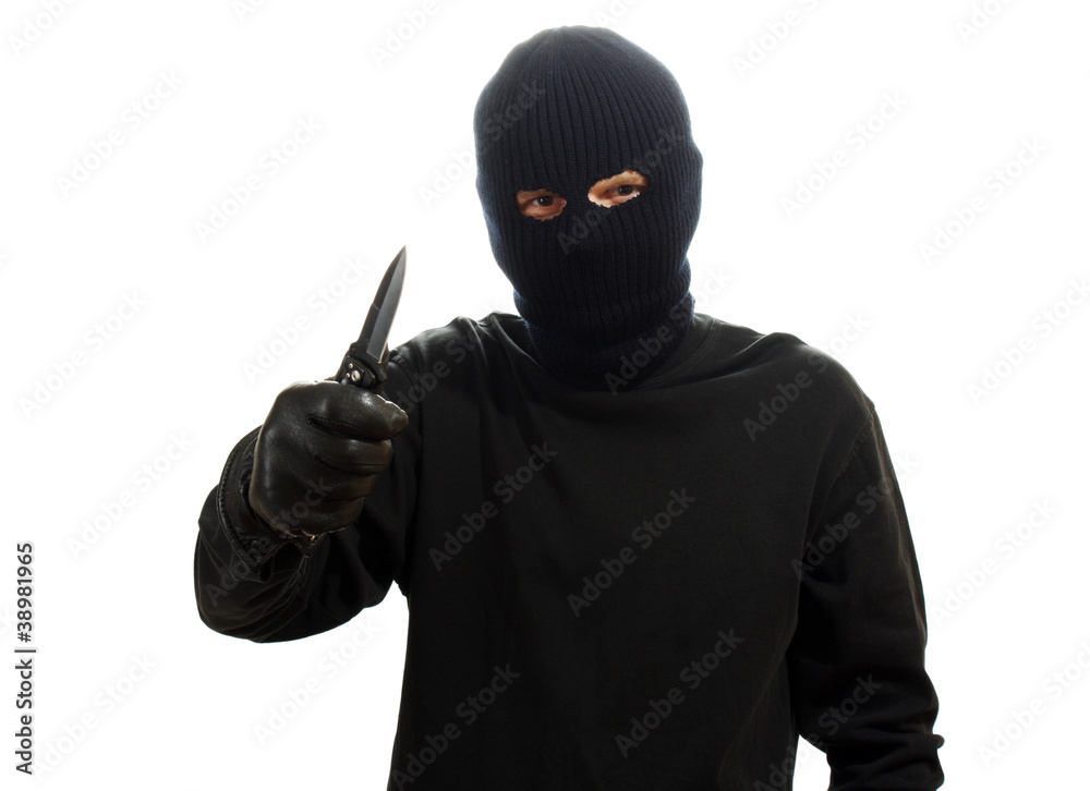 Bandit in black mask with knife isolated on white Bandit in black mask with knife isolated on white