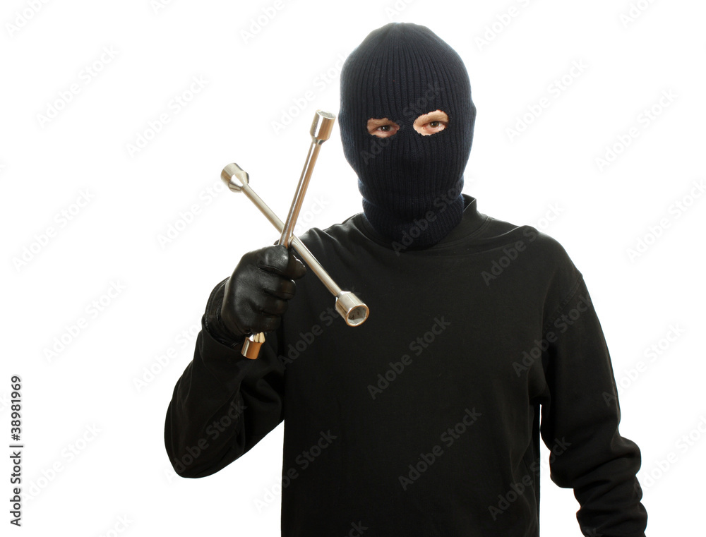 Bandit in black mask with wheel wrench isolated on white