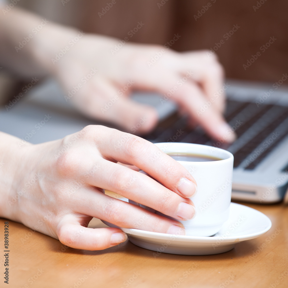 Checking email inbox with cup of fresh coffee