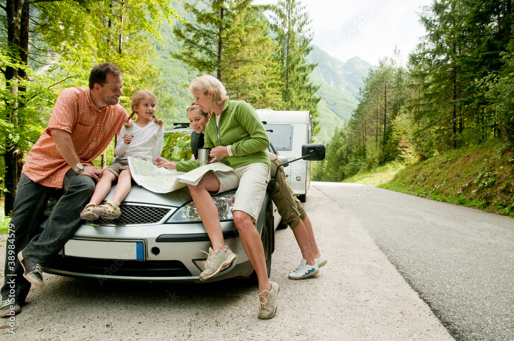 Travel - family with camping car on the road