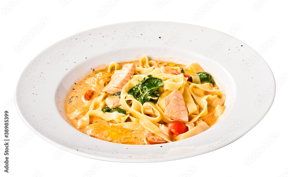 tasty pasta with cream, salmon, cheese and parsley close up tasty pasta with cream, salmon, cheese and parsley close up