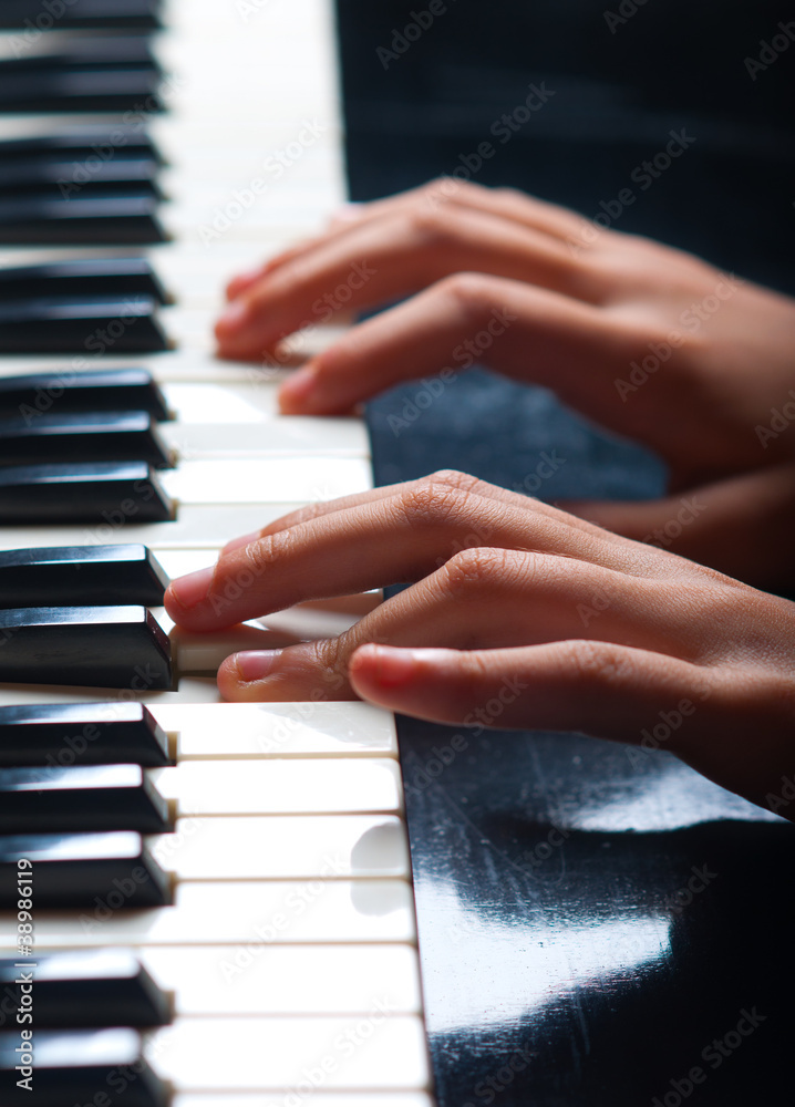 Child play on synthesizer