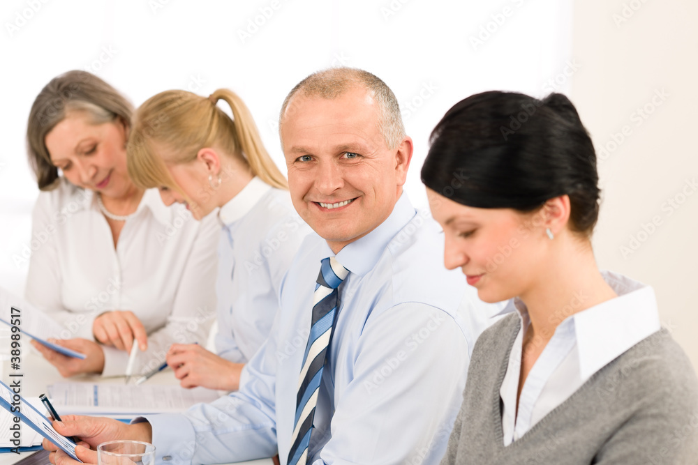 Smiling businessman during team meeting