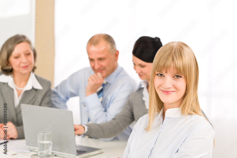 Businesswoman at team meeting with colleagues Businesswoman at team meeting with colleagues