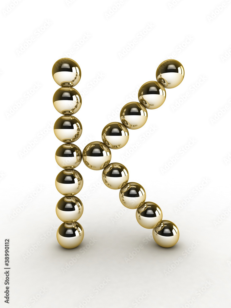 3d alphabet of gold beads.