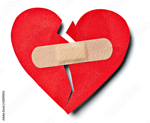 broken heart love relationship and plaster bandage photo