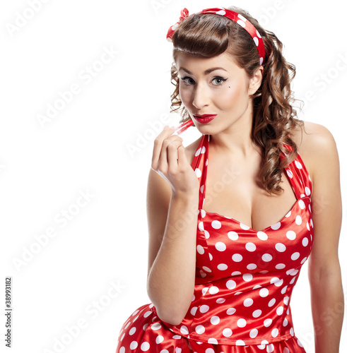 Pin-up woman applying her make-up